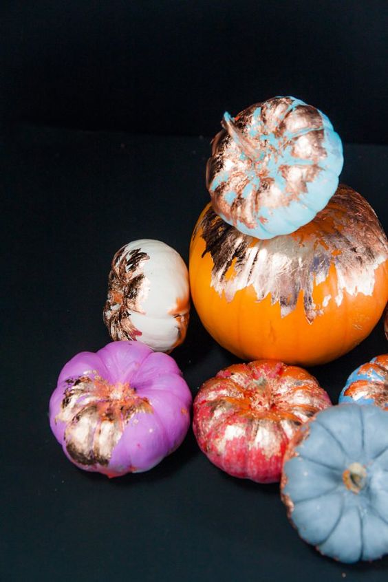 colorful pumpkins deocrated with gold foil are amazing for bright and fun Halloween and fall decor