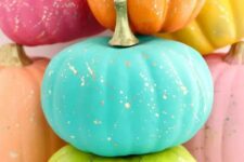 colorful pumpkins with gold splatters are a bold and fun solution for your fall decor
