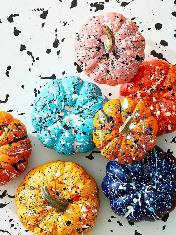colorful splatter pumpkins are a gerat idea for the fall and Thanksgiving, they will bring color and interest to the space