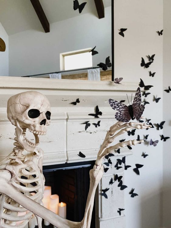 elegant Halloween decor with a skeleton with a butterfly, some butterflies attached to the fireplace and wall