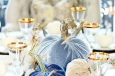 navy, blue, blue printed and tan velvet pumpkins are a refined and chic fall centerpiece to try