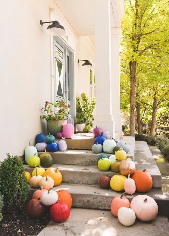 super colorful pumpkins placed on your porch will give it a fall feel and a colorful touch