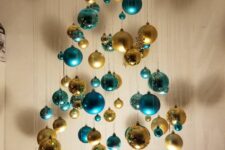 02 a beautiful floating Christmas tree of turquoise and gold ornaments of various sizes and shapes is amazing