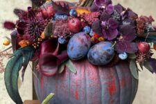 04 a gorgeous purple and red pumpkin decorated with plum and deep purple blooms, berries and fruits, bunny tails and foliage