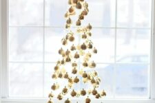 05 a floating Christmas tree made of gold ornaments is a stylish and super glam decor idea for holidays
