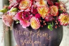 05 a sophisticated purple pumpkin with gold calligraphy, bold pink and yellow blooms, foliage and berries is amazing for Thanksgiving decor