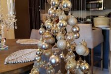06 a floating Christmas tree made of silver, glitter and clear ornaments is a stylish and modern alternative to a usual Christmas tree