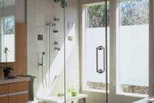 06 a modern bathroom with a shower space enclosed in glass and two windows partly done with frosted glass is a lovely idea
