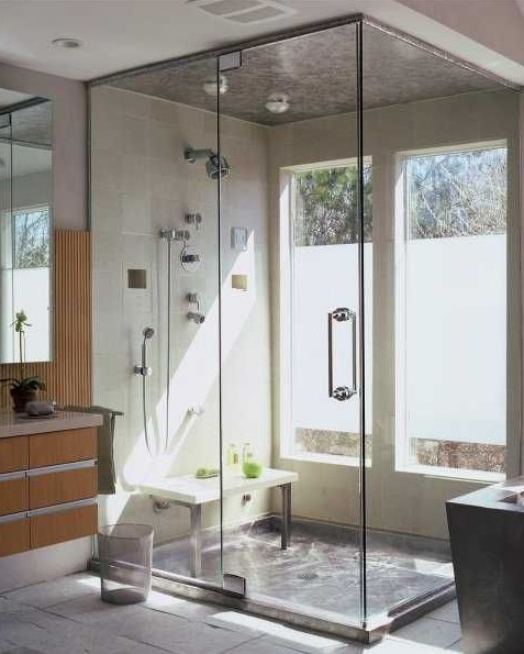 a modern bathroom with a shower space enclosed in glass and two windows partly done with frosted glass is a lovely idea