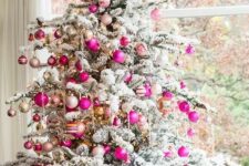 07 a flocked Christmas tree decorated with neutral, hot pink and blush ornaments and lights looks glam, chic and very modern