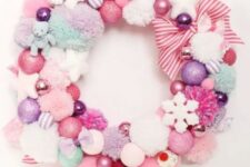 07 a pastel Christmas wreath of pompoms and ornaments, stars and snowflakes and striped ribbons is a pretty decoration