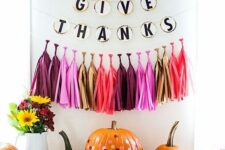 07 a pumpkin stand with colorful tassels and a banner, bright polka dot pumpkins and bold blooms is pure fun