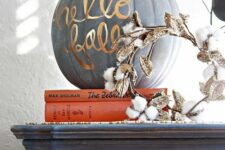 08 a matte grey pumpkin decorated with gold calligraphy is a chic and cool modern decor idea for Thanksgiving