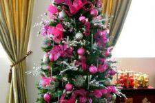 09 a glam Christmas tree with hot pink and fuchsia ornaments and fabric blooms, silver twigs, beads and lights is a bright idea