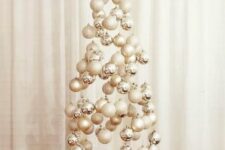 09 a neutral floating Christmas tree composed of silver, white and glitter ornaments is a great idea for a neutral space