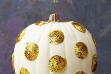 09 a white pumpkin with large gold sequin polka dots will give a cool glam feel to your Thanksgiving decor