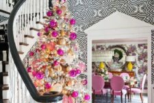 10 a glam flocked Christmas tree decorated with lots of hot pink, pink, gold and champagne ornaments and lights