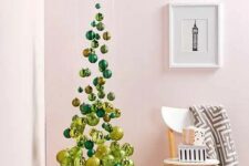10 a small and elegant suspended Christmas tree of emerald and gold ornaments, shiny and glitter ones is an airy idea