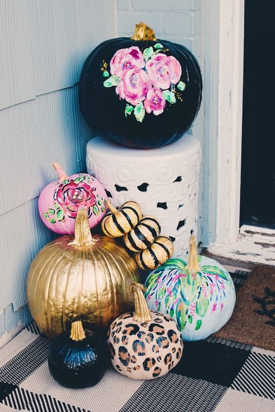 bright fall pumpkins - black with pink florals, pink, green, leopard, gold and black stripe ones - for fall porch decor