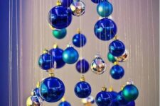 11 a small Christmas tree of matte and shiny blue ornaments and little silver ones is a whimsy and creative DIY idea