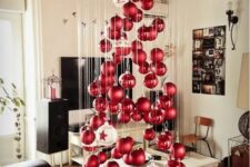 14 a large floating Christmas tree of matte and shiny Christmas ornaments and a couple of large white ones