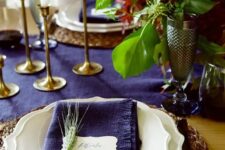 15 a bold violet table runner and napkins plus burgundy blooms make up a super bright tablescape
