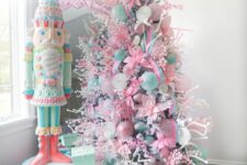 15 a candy-colored Christmas tree decorated with pastel pink and green ornaments and ribbons of various kinds and looks