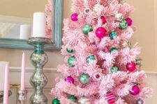 16 a pastel pink Christmas tree decorated with hot pink and green ornaments is a stylish vintage decor idea