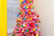 17 a pink Christmas tree decorated with super bold ornaments and chains of paper is a bold idea for a kids’ space