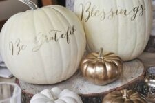 18 white pumpkins decorated with simple gold calligraphy look very stylish and elegant and are easy to make