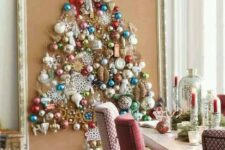 21 a large Christmas tree on canvas with a vintage frame is shaped only of colorful vintage ornaments for a chic look