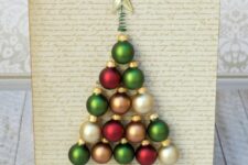 22 a little Christmas tree art of white, red and green ornaments, with a star on top is a lovely idea