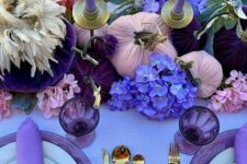 23 a glam Thanksgiving tablescape with a lilac tablecloth and napkins, lilac candles, purple, deep purple and violet blooms and gilded cutlery