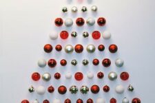 25 a simple and stylish red, gold and white Christmas ornament tree is a lovely idea for a small space or as alternative