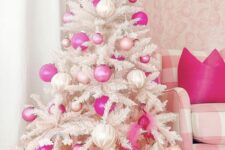 25 a white Christmas tree decorated with pearly, light and hot pink ornaments and some rainbows is a amazing for the holidays