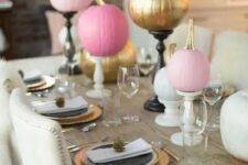 26 bright pink and gold pumpkins with bold blooms on stands will spruce up your Thanksgiving tablescape