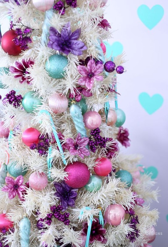 a white Christmas tree with blush, pink, aqua and purple ornaments, beads and purple fabric blooms is a fantastic idea