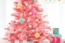28 a pastel pink Christmas tree decorated with pastel pink, yellow, aqua and purple ornaments is a very cute and sweet idea