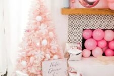 30 a pastel pink Christmas tree decorated with white pompoms, ice cream cones, snowflakes is a dreamy and pretty idea for a glam space
