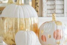 31 glam pumpkin decor with white and gold color block, with metallic oversized polka dots is a lovely idea for Thanksgiving