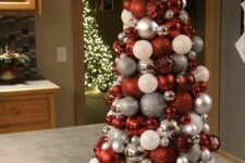 32 a lovely tabletop Christmas tree of red, white and silver ornaments topped with a red star is perfect for Christmas