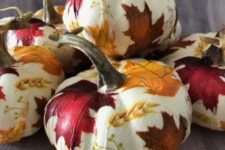 32 lovely white pumpkins decorated with bold fall leaves and wheat using Mod Podge look amazing and will be a nice solution for the fall and Thanksgiving