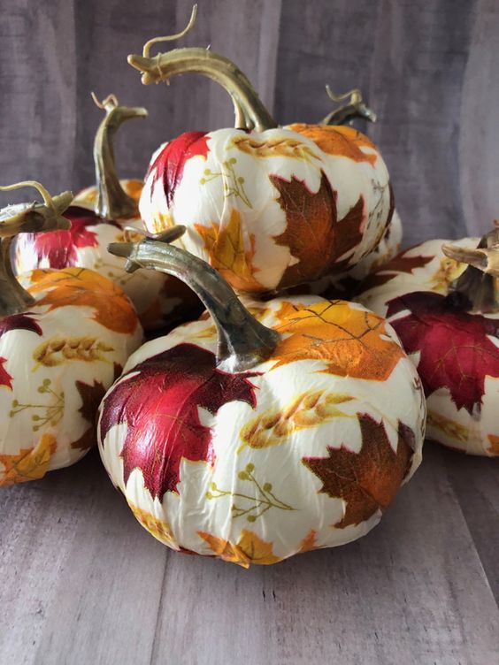 lovely white pumpkins decorated with bold fall leaves and wheat using Mod Podge look amazing and will be a nice solution for the fall and Thanksgiving
