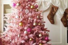 33 a pastel pink Christmas tree with sheer, gold and pink ornaments with a vintage feel looks very sophisticated