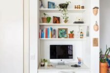 33 a tiny nook with built-in shelves and a desk with a drawer, a white chair, books and potted plants is a cool space fo working