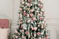 35 a romantic Christmas tree decorated with blush, pink and white ornaments, roses and hearts and with pink gift boxes under it