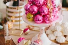 37 hot pink Christmas ornaments in a cloche will become a lovely Christmas centerpiece or a decoration for a dessert table