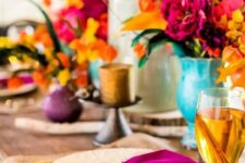 37 set a tablescape with orange, mustard, hot pink and purple hues to remember this Thanksgiving