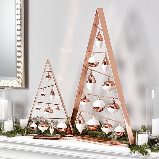 A-frame ornament Christmas trees in copper and white look very chic and stylish and make up a cool alternative to a usual Christmas tree
