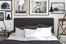 a b&w bedroom with a gallery wall